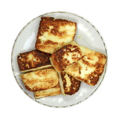 Grilled cheese isolated. Grilled slices of halloumi cheese isolated on white background. 