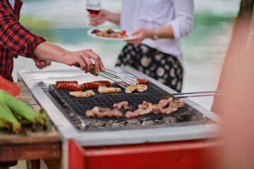 man cooking tasty food for french dinner party