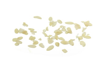 Blanched almonds flakes. Pile of peeled flaked almonds isolated on white.