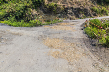 Potholed road near Dehang Miao village, Hunan province, China