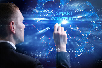 Business, Technology, Internet and network concept. Young businessman working on a virtual screen of the future and sees the inscription: Smart contract