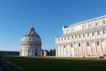 Pisa, Italy. Piazza dei Miracoli with the Duomo, the Baptistery and the Cemetery with the evening light and the blue sky