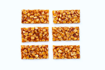 Honey bars with peanuts on white background