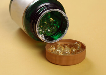 Vitamin D pills in open container