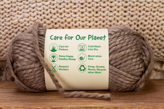 Care For Our Planet Label On Ball Of Wool With Care Icons And Text, Sustainable Fashion And Ethical Consumerism