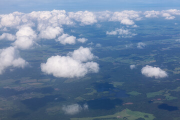 Cumulus clouds over the earth . Clouds leave a shadow on the ground 
