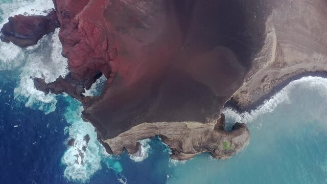 Top view of volcanic island of Faial surrounded by atlantic ocean, Faial Island, Azores, Portugal, Europe. Aerial view of Capelinhos Volcano formed by lava eruptions. 4k footage