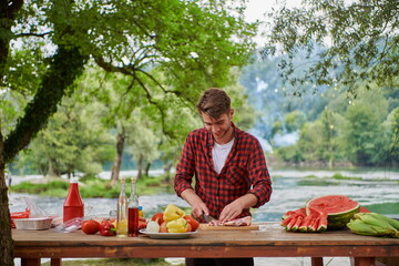 man cooking tasty food for french dinner party