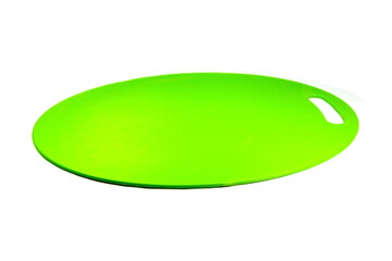 Green plastic cutting board on white background 