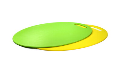 Green an yellow plastic cutting board on white background 