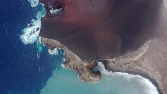 Capelinhos Volcano, Faial Island, Azores, Portugal. Aerial view of extraordinary mosaic of colors in the sea. A remarkable geodiversity of the Faial Island seen from above. High quality 4k footage
