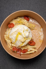 Take out burrata with artichokes, cherry tomatoes, parmesan, tossed in olive oil