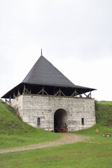 Fototapeta premium Entrance tower near Khotyn fortress of the X XVIII centuries with a fortification complex, One of the seven wonders of Ukraine located on the right bank of the river Dniester in the city of Khotyn.