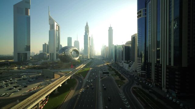 Dubai, United Arab Emirates - 16 March 2021: Aerial view of Sheikh Zayed road crossing the financial district with tall skyscrapers in Dubai downtown, United Arab Emirates.