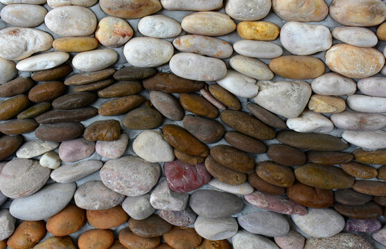 Stones of many colors are placed as pictures and art.