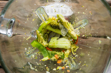 Vegetable fresh smoothie mixed in a vegetable blender, top view. healthy food detox.Flat lay