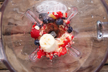 Fresh fruit smoothies blended in a blender, top view. Slimming, detox concept.Healthy and tasty...