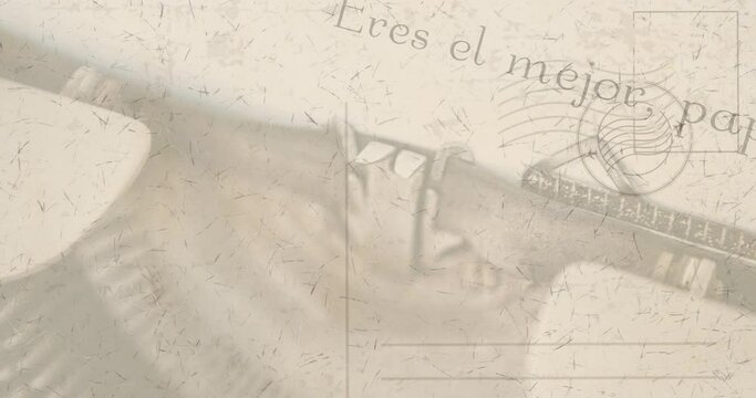 Animation of vintage typewriter with spanish written letter over stamped envelope
