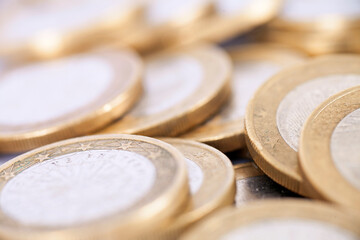 A pile of dollars and coins