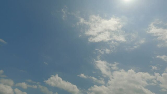 4k Time Lapse Footage of White fluffy and billowing clouds in a rich blue sky