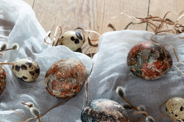 Easter composition - Easter eggs painted with natural dyes on a wooden table