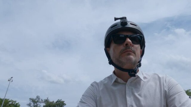 Caucasian Man riding a vintage bicycle on a rural bike path, handlebar cam POV.