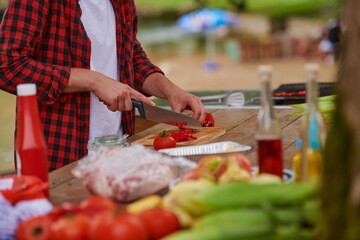 man cooking tasty food for french dinner party