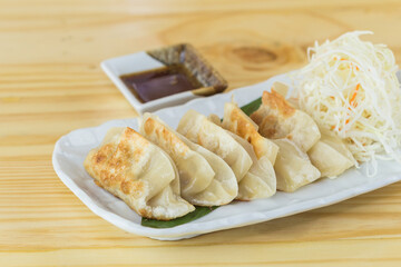 Japanese gyoza or dumplings snack with soy sauce
