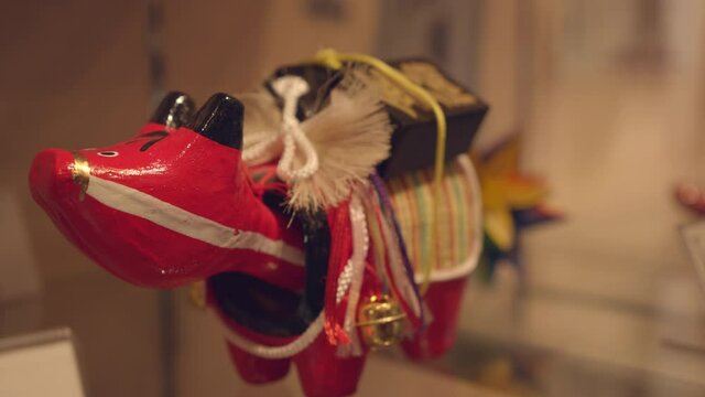 Akabeko, a local toy from the prefecture of Fukushima bouncing it's head up and down. Famous toy of Aizu akabeko is a symbol that is thought to repel sickness