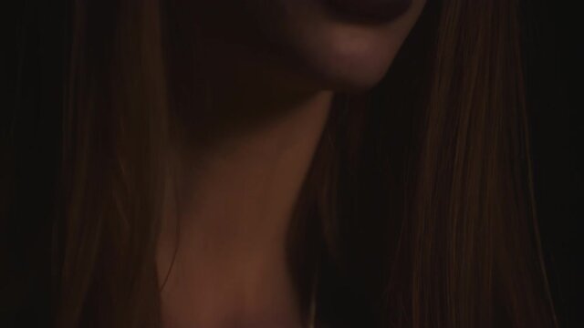 Closeup Face of Wiccan Lady Practices Speaking to Demonic Spirits, tilt up reveal