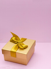 boxes for presentations of different colors on a pink background. Festive backdrop for holidays: Birthday, Valentines day, Christmas, New Year.