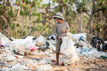 child walk to find junk for sale and recycle them in landfills, the lives and lifestyles of the...