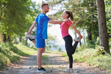 couple enjoying in a healthy lifestyle warming up and stretching before jogging
