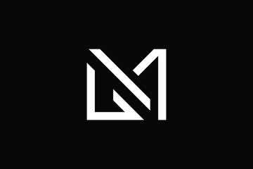 Fototapeta premium MG logo letter design on luxury background. GM logo monogram initials letter concept. MG icon logo design. GM elegant and Professional letter icon design on black background. M G GM MG