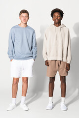 Teenage boys in blue sweater and beige for streetwear apparel shoot