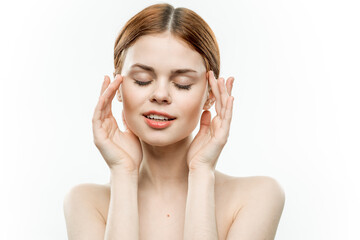 Fototapeta premium woman holding glamor face attractive look naked shoulders closed eyes