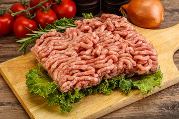 Raw pork minced meat over board
