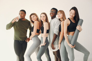 Sports group standing on a white background