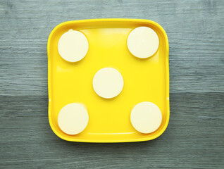 fresh raw tofu sliced on square plate  on wood, wooden background,set shabu, hot pot ingredients.
