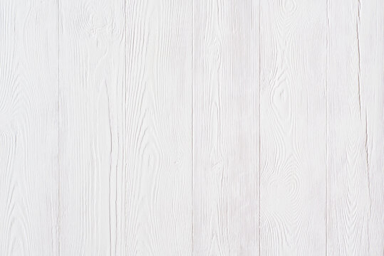 White pаinted pine board background with vertical fibers.