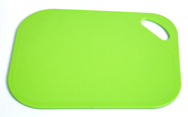 green board cuting plastic isolated on white background