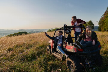 group young happy people enjoying beautiful sunny day while driving a off road buggy car