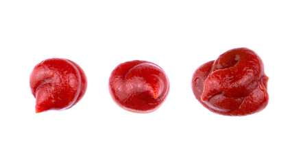 Ketchup splashes, group of objects. Arrangement of red ketchup or tomato sauce, isolated white background, top view.