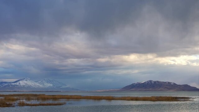 Rain storm rolling over Utah Lake in time lapse looking towards Mt. Nebo and West Mountain.