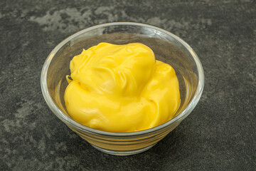 Natural cheese sauce in the bowl