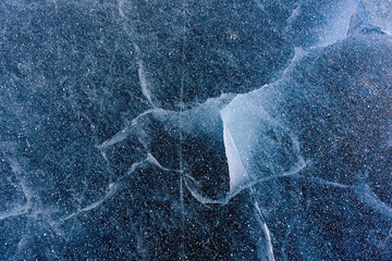 Beautiful ice of Lake Baikal with abstract cracks
