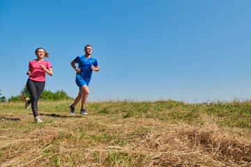 Fototapeta na wymiar couple jogging in a healthy lifestyle on a fresh mountain air
