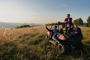 group young happy people enjoying beautiful sunny day while driving a off road buggy car