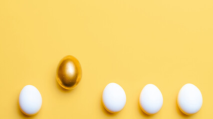 Easter set. Golden, white colour egg on pastel yellow background in Happy Easter decoration. Traditional design with copy space.