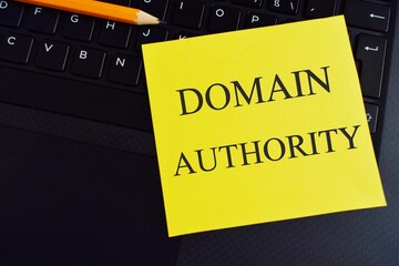 Text Domain Authority written on a colorful sticker note. The concept means a computed metric of...